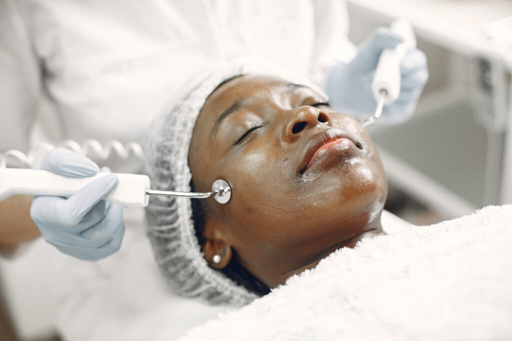 girl doing facial procedures to beautician
